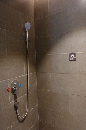 A shower area with a handheld showerhead and a wall-mounted control panel. - Fushang Hotel (Chenzhou Yuhou Street Nanta Park) (Chenzhou)