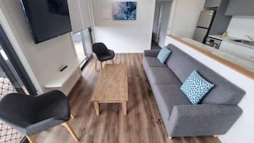Deluxe Cabin, Balcony | Living area