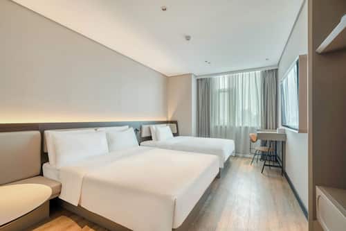 Premium bedding, desk, laptop workspace, blackout curtains