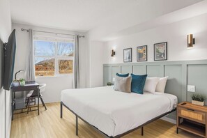 1 bedroom, desk, iron/ironing board, travel crib