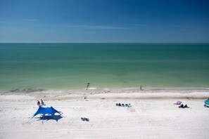 On the beach, beach towels, motor boating