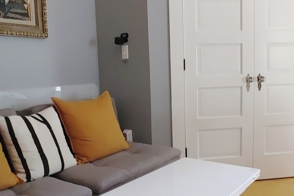 Danish design meets comfort — stylish chairs by day, cosy double bed by night.