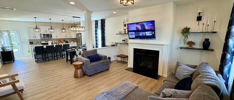 Smart TV, fireplace, books, music library