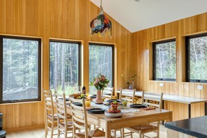 Spacious dining area perfect for shared meals and gatherings. - Walk to Beach, Arch Cape Getaway w/ Vibrant Interior | Cape Wonder by AvantStay (Arch Cape)