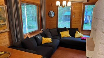 Cabin, 2 Bedrooms, Patio | Living room | Books