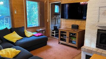 Cabin, 2 Bedrooms, Patio | Living room | Books