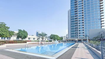 Outdoor pool, pool umbrellas, sun loungers