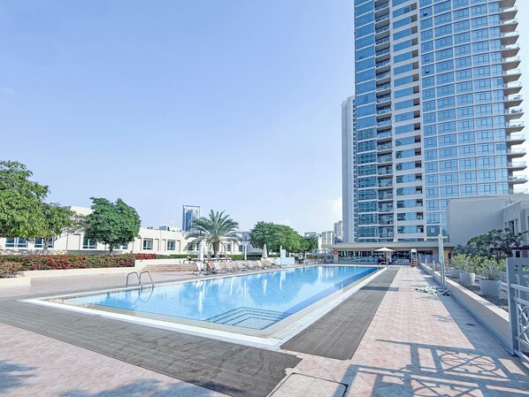 Outdoor pool, pool umbrellas, pool loungers