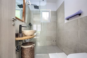 Shower, hair dryer, towels, soap