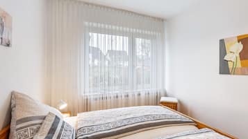 2 dormitorios, tabla de planchar con plancha, wifi gratis y ropa de cama