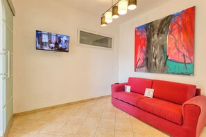 Family Apartment, Multiple Bedrooms, Mountainside (Miramare 2 LUX - Total Sea View) | Living area | 21-inch flat-screen TV with satellite channels