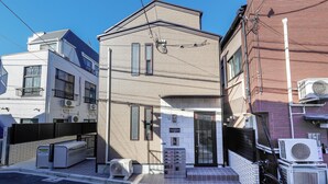 A modern two-story building with a flat roof, large windows, and a visible entrance. - Zenith Shinjuku Hinoki by Tranova (Tokyo)