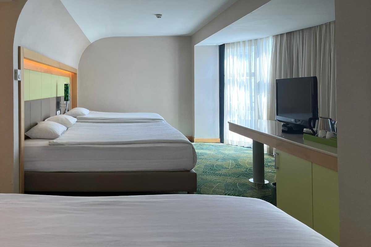 Standard Room, Multiple Beds, Garden View | 1 bedroom, premium bedding, free minibar, in-room safe