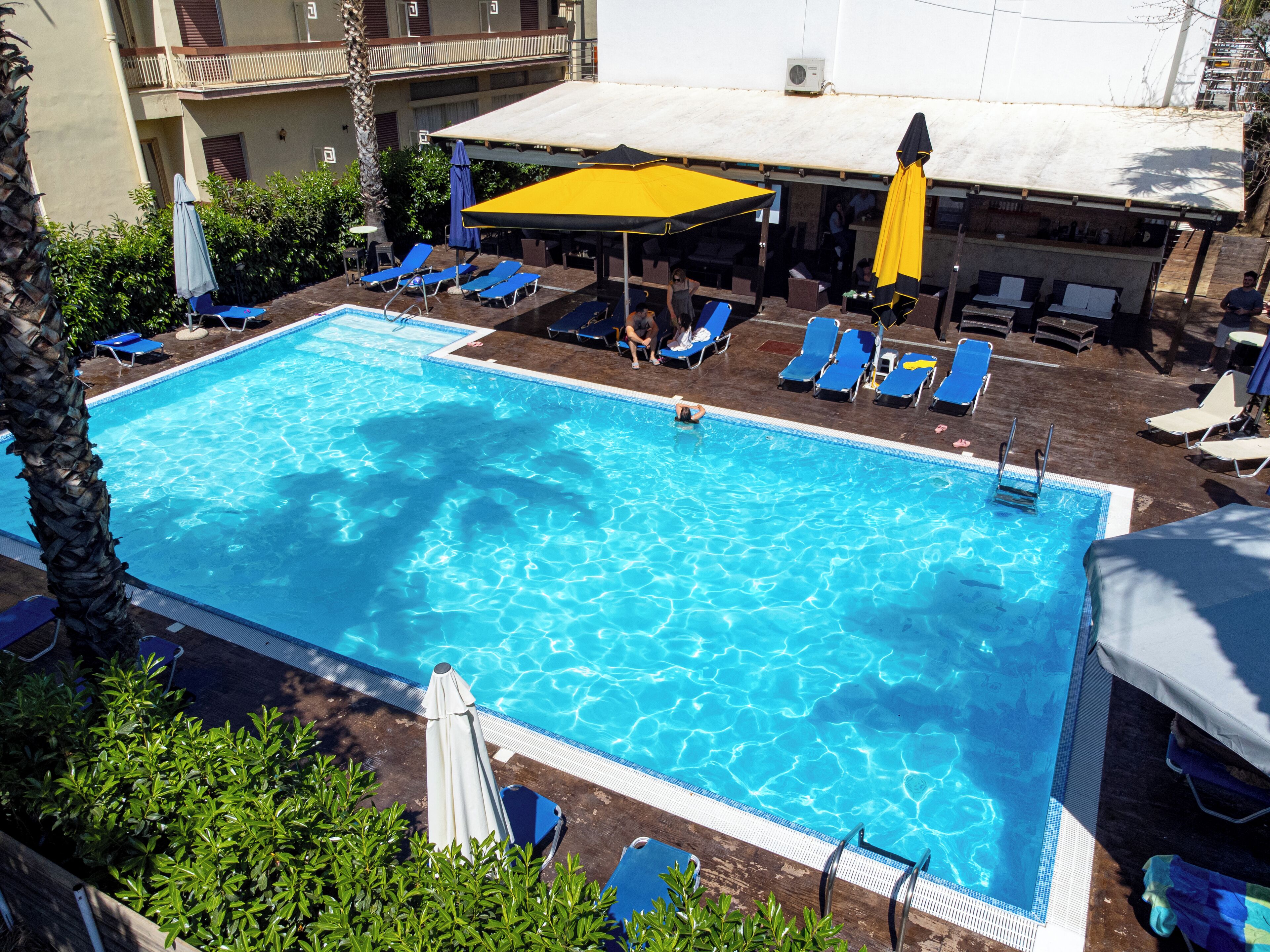 Seasonal outdoor pool, open 11:00 AM to 8:00 PM, pool umbrellas