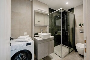 Shower, hair dryer, towels, soap