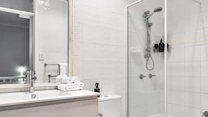 Shower, hair dryer, towels