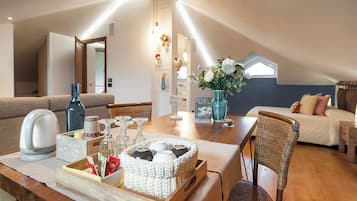 Superior Suite, Balcony | Living area | TV