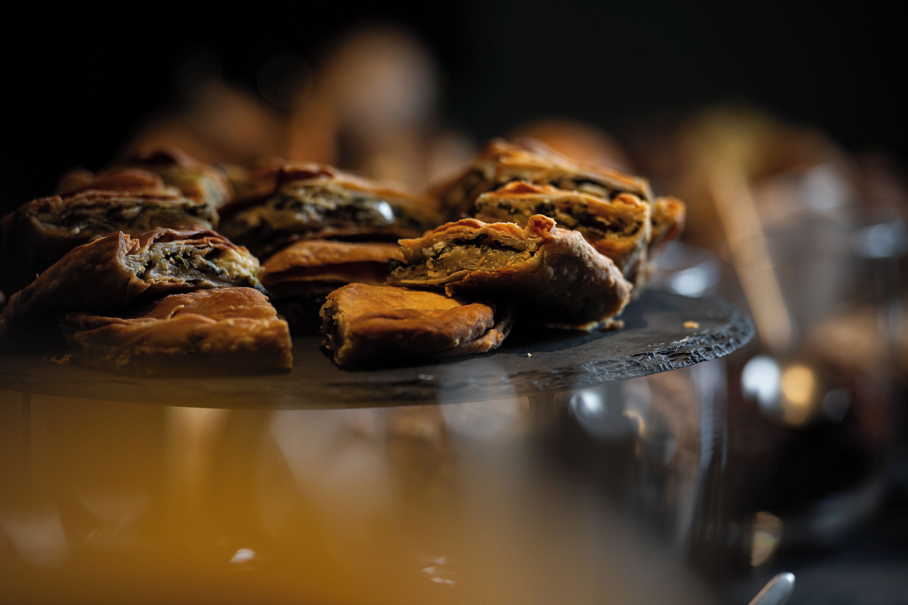 A close-up of pastries on a glass plate.