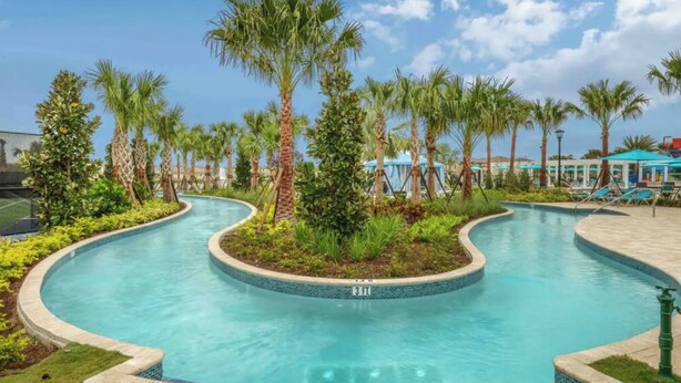 A pool with a 3 ft depth marker, surrounded by palm trees and lounge chairs. - The Fantasy 8BR Villa at Windsor Westside/Pool/Spa (Kissimmee)