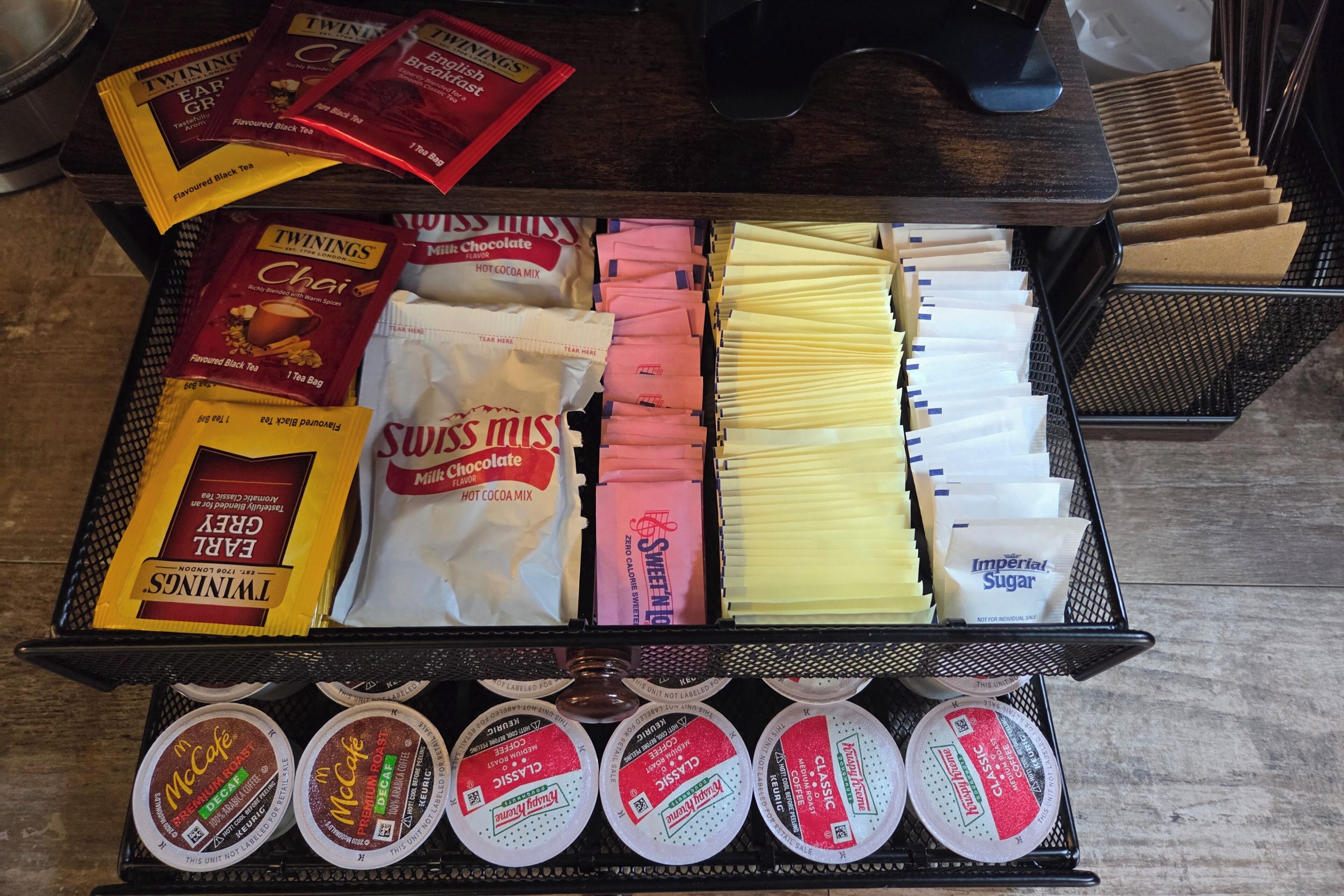 A tray of assorted coffee and tea bags.