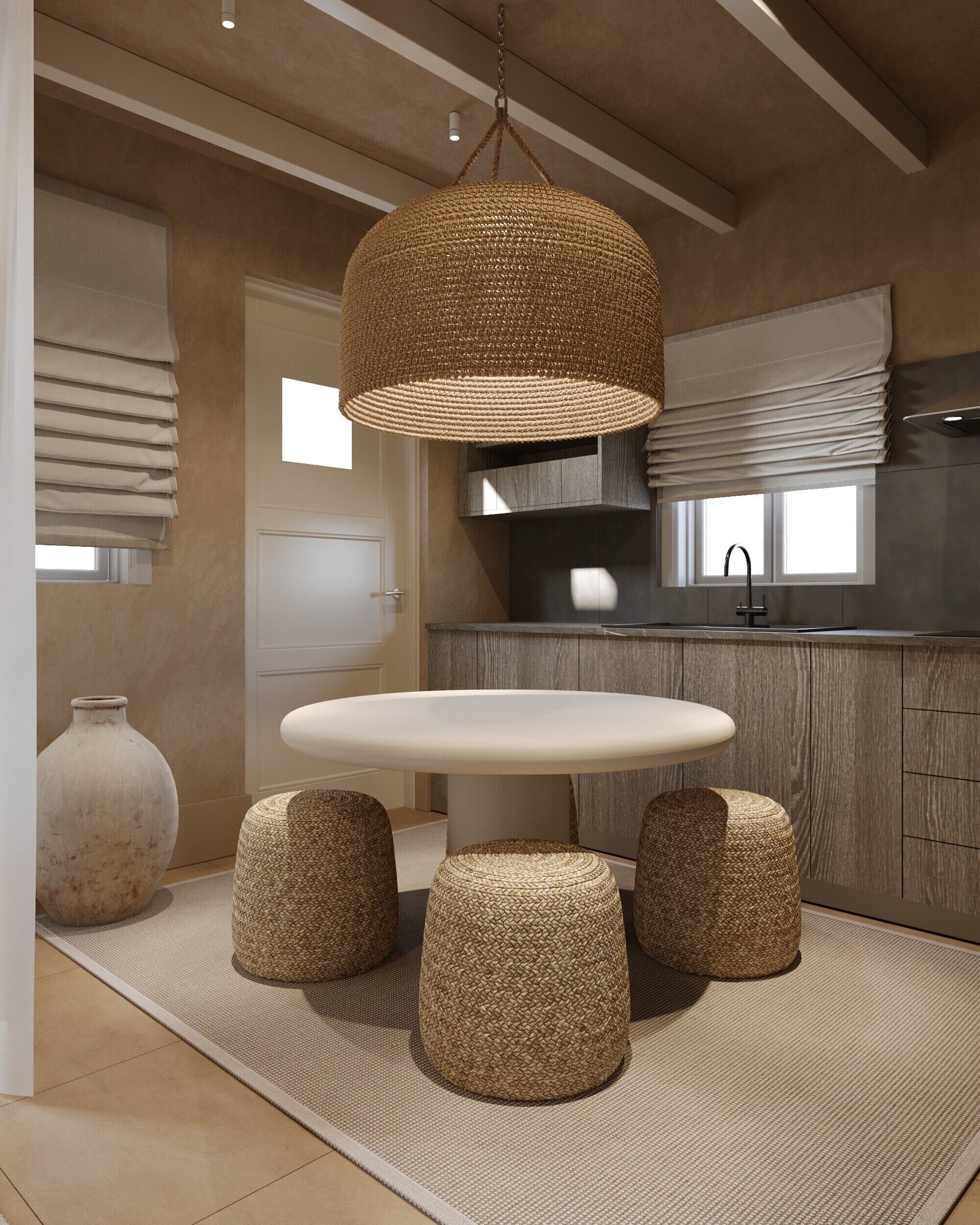 A modern kitchen with a round dining table, woven stools, and a hanging light fixture.