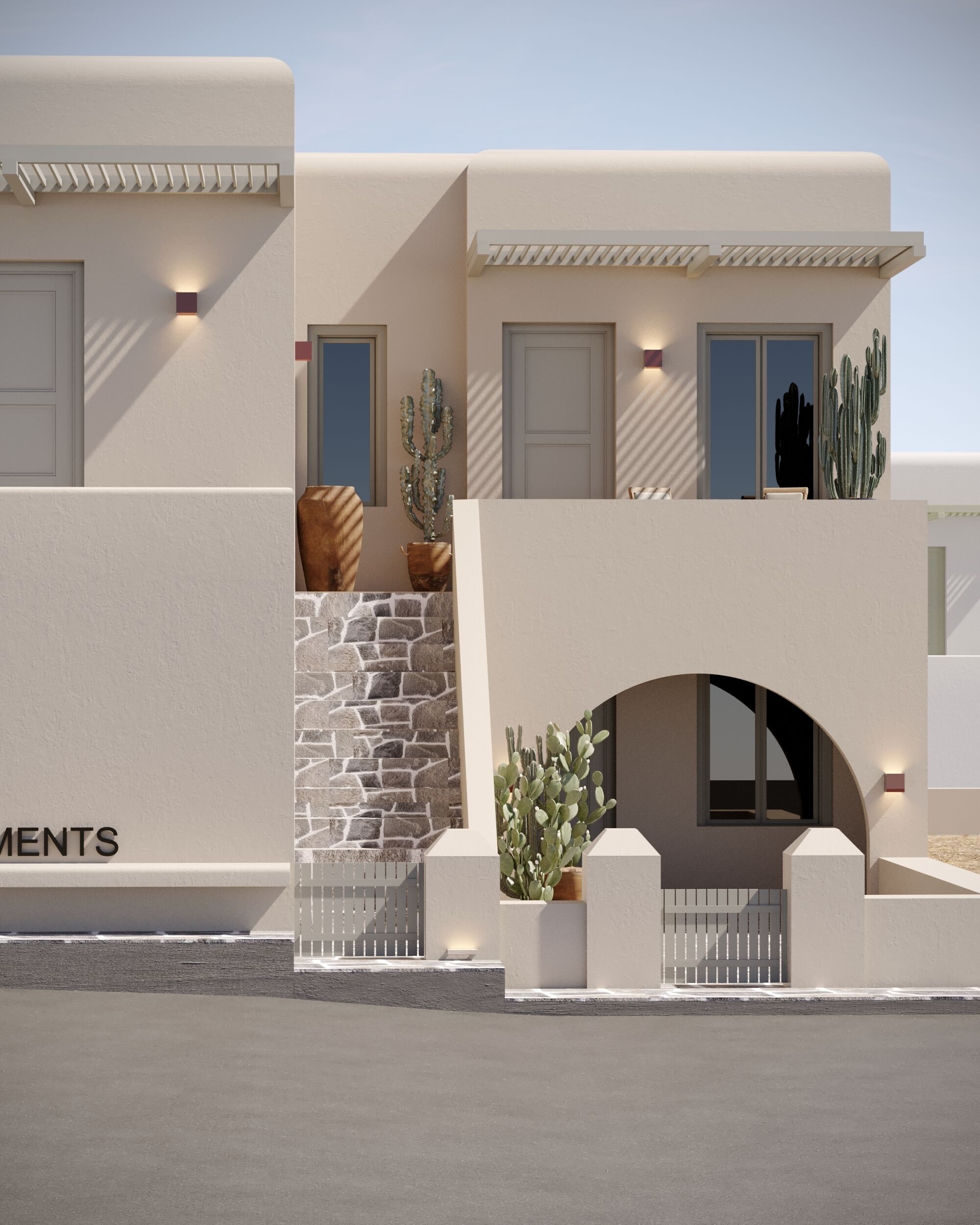 A modern building with a stone facade, multiple doors, and cacti.