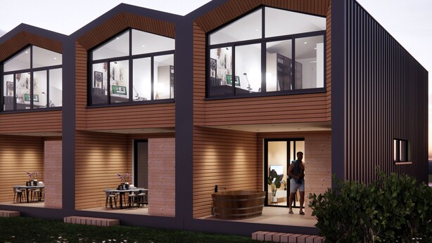 A modern multi-story building with large windows, a wooden facade, and a well-maintained garden.