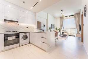 Fridge, microwave, oven, stovetop - City Views 1BR Near Community Park with Private Balcony, Binghatti House, JVC (Dubai)