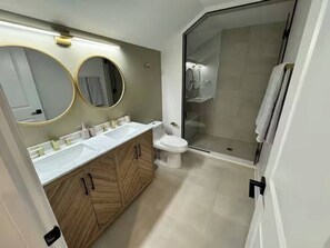 Shower, towels, soap, toilet paper