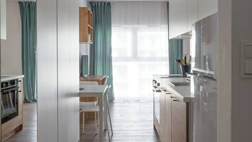 Suite Studio Classique | Coin séjour | Télévision à écran plat