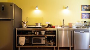 A modern kitchen with stainless steel appliances, a microwave, and a dishwasher.