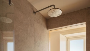 A modern bathroom with a shower, a view of the city, and a balcony. - LIOZ Lisboa (Lisbon)