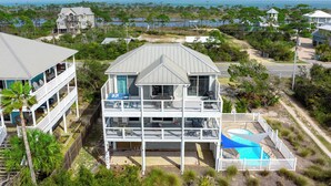 A multi-story house with a balcony and a swimming pool. - 🧜The Gulf Club🧜 Beach Views | Private Pool | Walk to Beach (Cape San Blas)