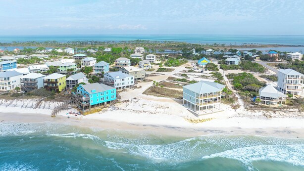 A coastal residential area with beachfront properties, including houses with balconies and a beach access point. - 🧜The Gulf Club🧜 Beach Views | Private Pool | Walk to Beach (Cape San Blas)