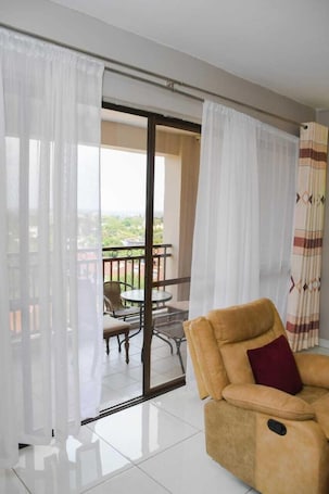 Classic Apartment, City View | Living area | 32-inch Smart TV with digital channels