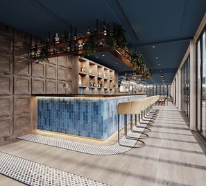 A modern bar area with a long counter, bar stools, and a variety of bottles and glasses. - Mpilo Boutique Hotel (Maseru)