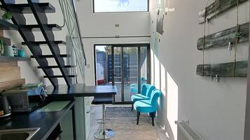 Appartement Confort, coin cuisine | Coin séjour