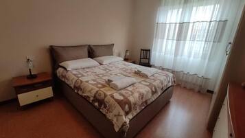 1 bedroom, desk, iron/ironing board, travel crib