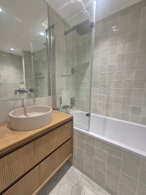 Shower, hair dryer, towels, toilet paper