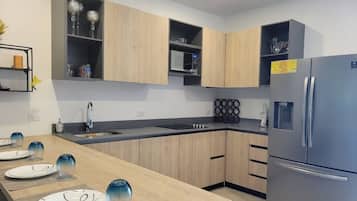Fridge, microwave, stovetop, coffee/tea maker
