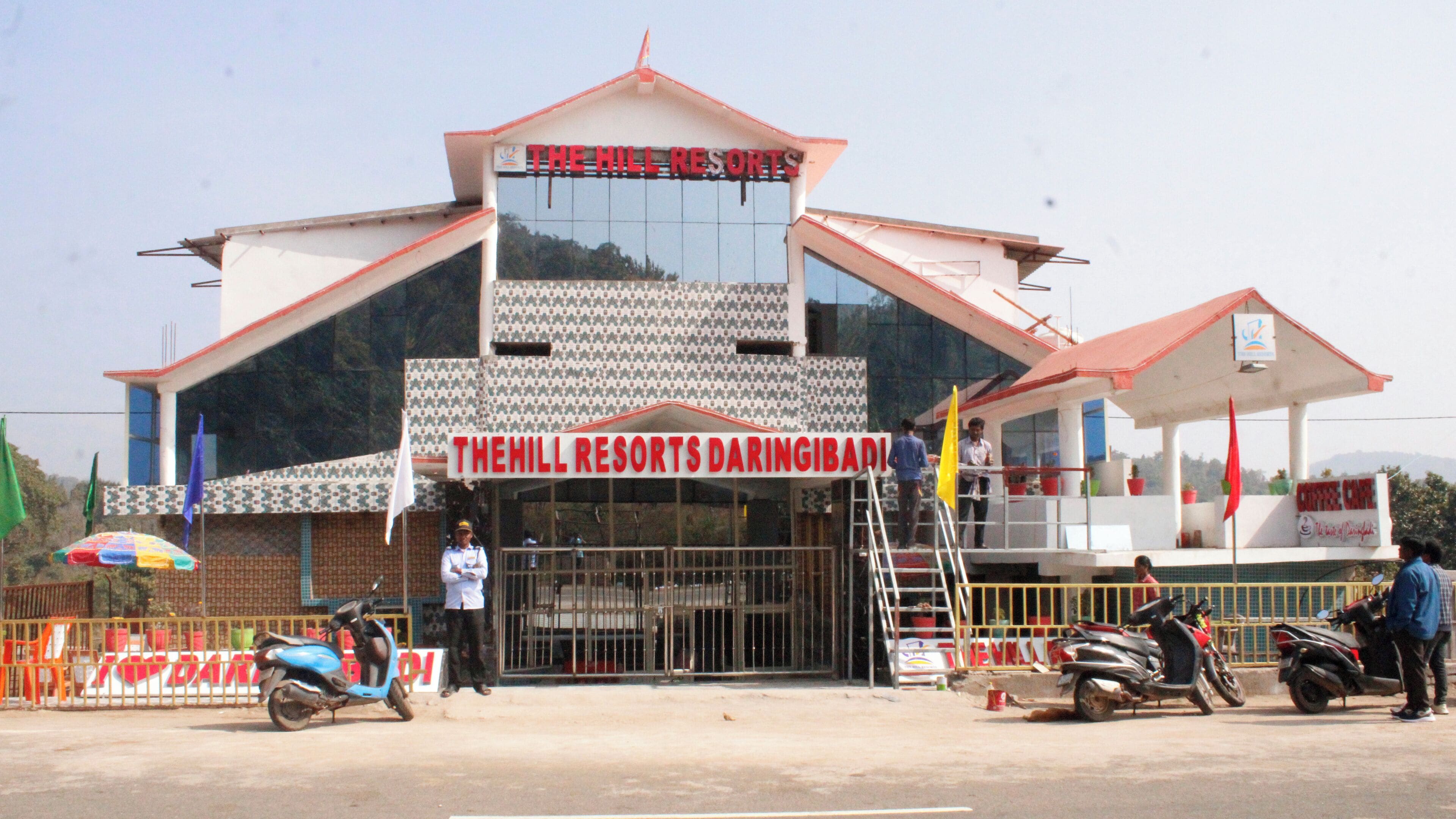 A building with a sign reading "THE HILL RESORTS DARINGIBAD".
