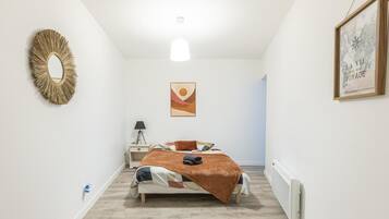 1 bedroom, desk, iron/ironing board, travel crib