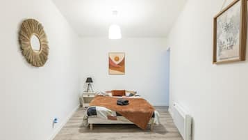 1 bedroom, desk, iron/ironing board, travel crib