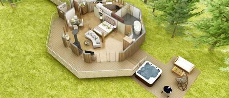 A circular outdoor living space with a hot tub, seating area, and a small kitchen.