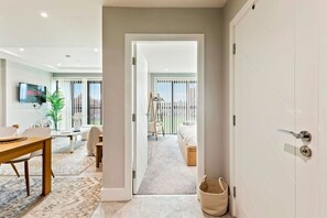 1 bedroom, desk, iron/ironing board, travel crib