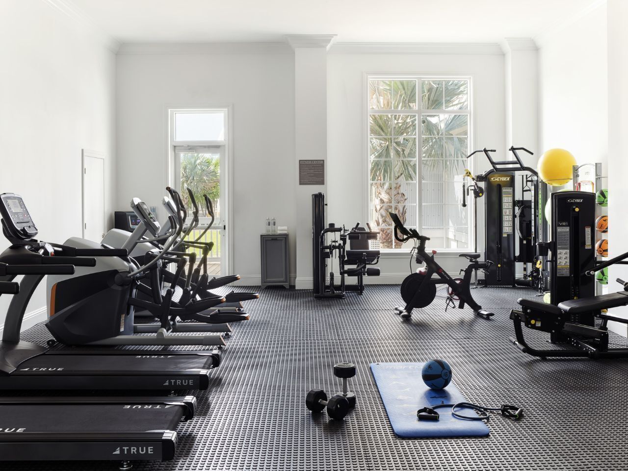 A well-equipped fitness center bathed in natural light, offering a refreshing space to recharge and stay active.
