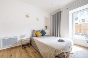 1 bedroom, desk, iron/ironing board, travel crib