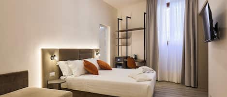 Kamar Triple Deluks, Bebas Asap Rokok, pemandangan kota | Area keluarga | Televisi layar datar 28-inci dengan saluran TV digital