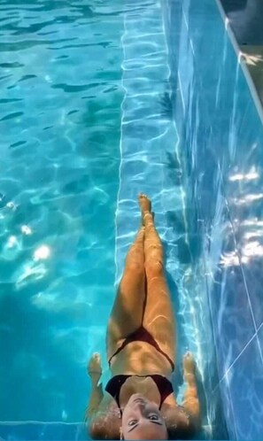 Seasonal outdoor pool, open 8:30 AM to 9:00 PM, pool umbrellas