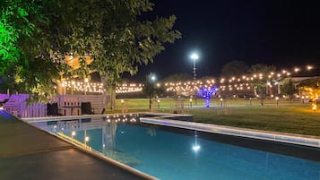 Seasonal outdoor pool, open 8:30 AM to 9:00 PM, pool umbrellas